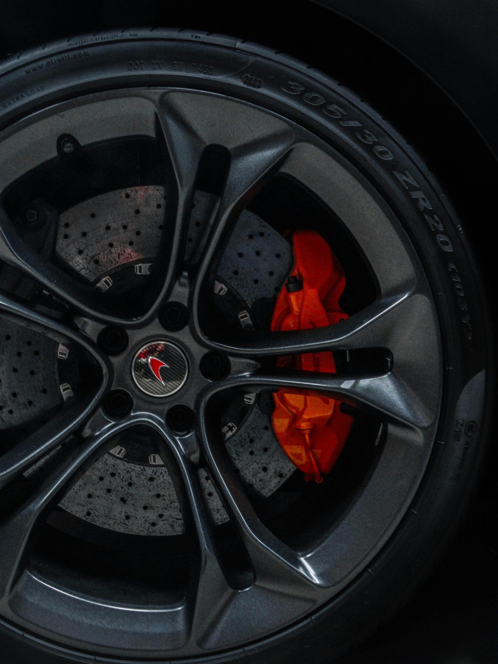 Detailed image of a high-performance car wheel with visible brake caliper.